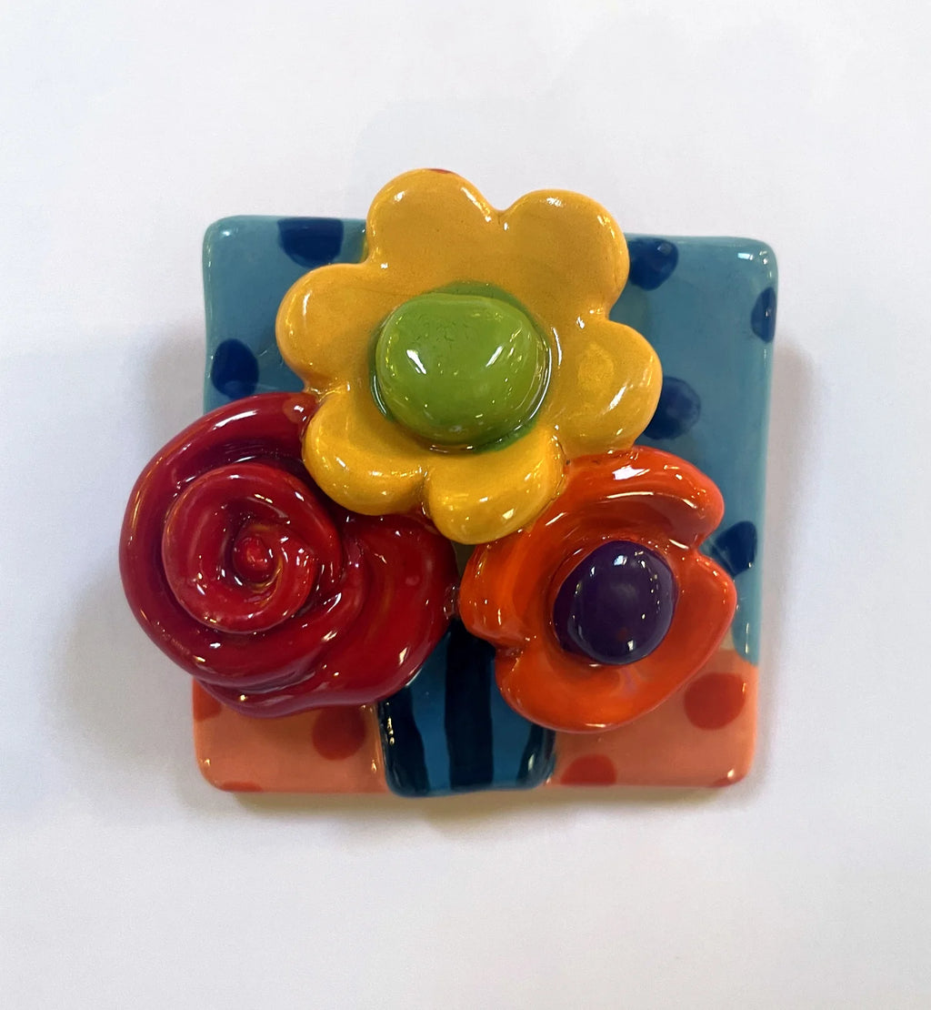 Brooch with Blue and Peach Background