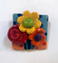 Brooch with Blue and Peach Background