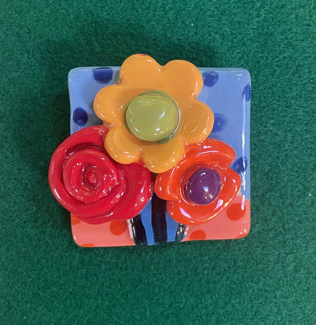 Brooch with Blue and Peach Background
