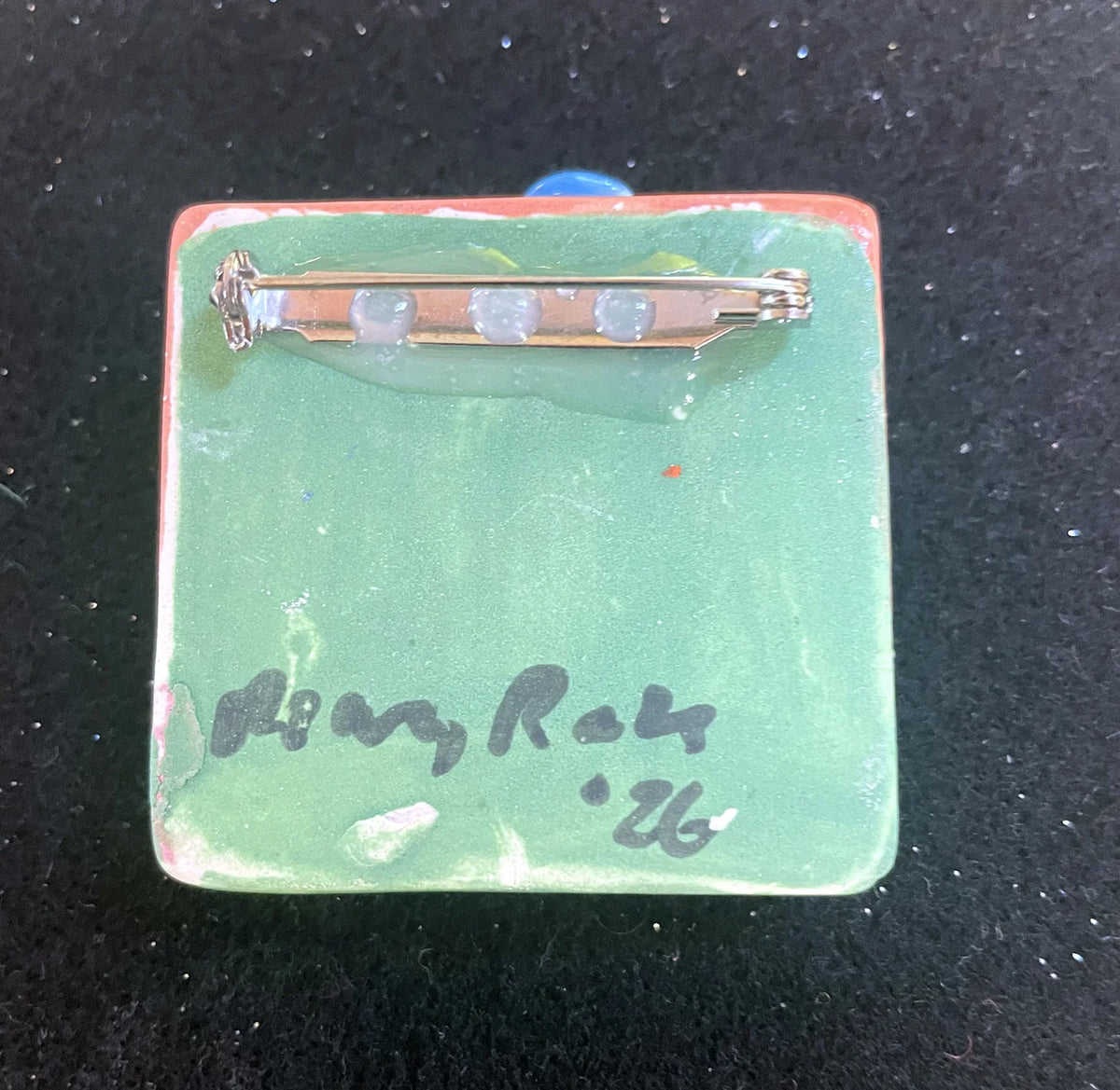 Brooch with Peach and Green Background