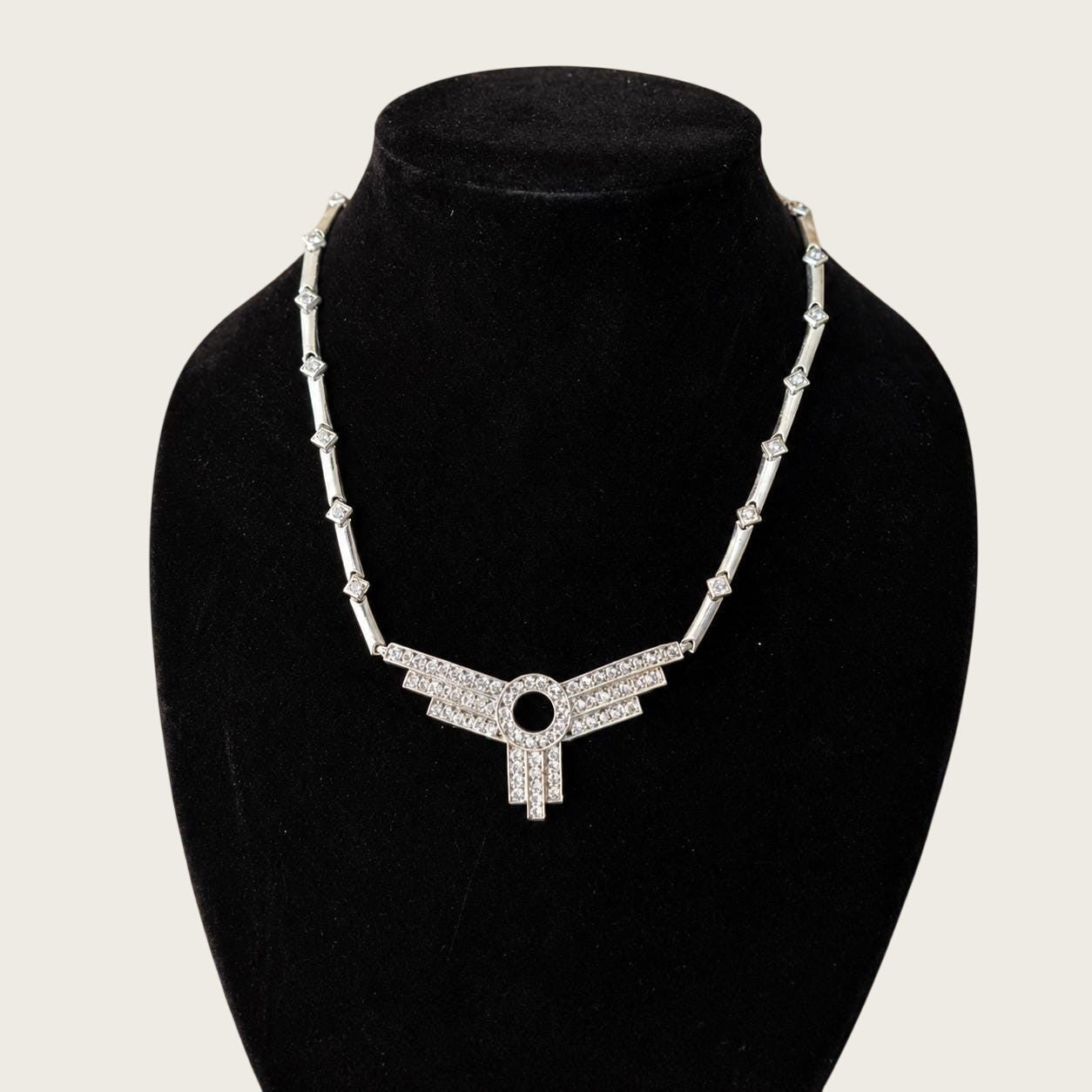 Belcaro Heirlooms vintage Art Deco revival silver-tone necklace with a geometric rhinestone fan pendant on display.