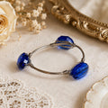 Youmi K Silver Tone Wire Bangle Bracelet with Large Faceted Cobalt Blue Acrylic Stones