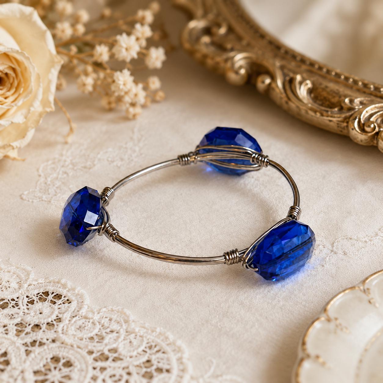 Youmi K Silver Tone Wire Bangle Bracelet with Large Faceted Cobalt Blue Acrylic Stones