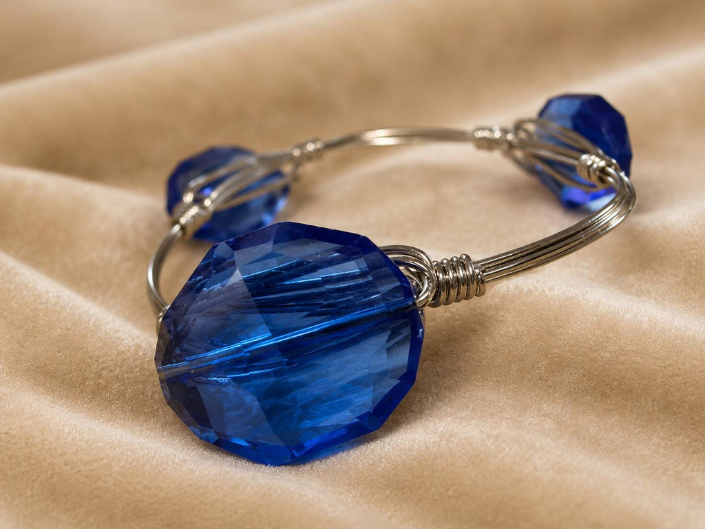 Youmi K Silver Tone Wire Bangle Bracelet with Large Faceted Cobalt Blue Acrylic Stones
