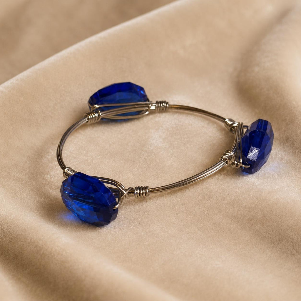 Youmi K Silver Tone Wire Bangle Bracelet with Large Faceted Cobalt Blue Acrylic Stones