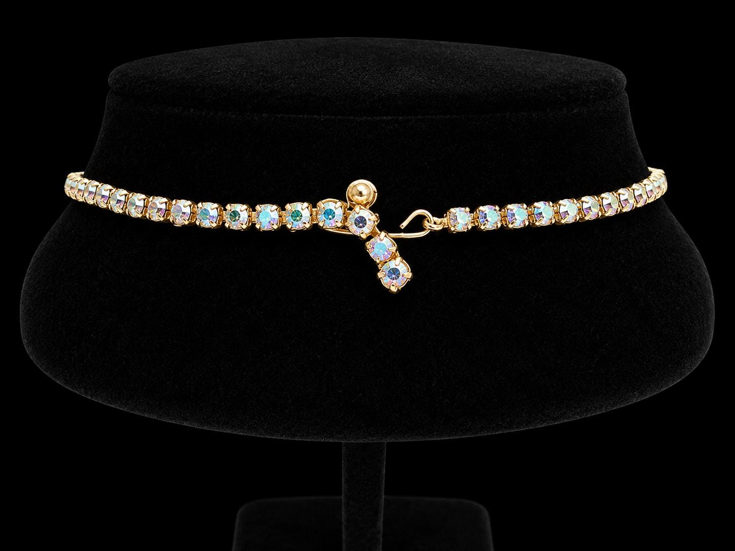 Gold-tone prong-set rhinestone / crystal necklace