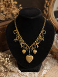 Vintage Sadie Green Signed Green Glass Charm Necklace Heart Lockets Victorian Revival Gold Tone