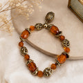 Vintage Amber Bead Stretch Bracelet With Gold Tone Filigree Charm Dangle