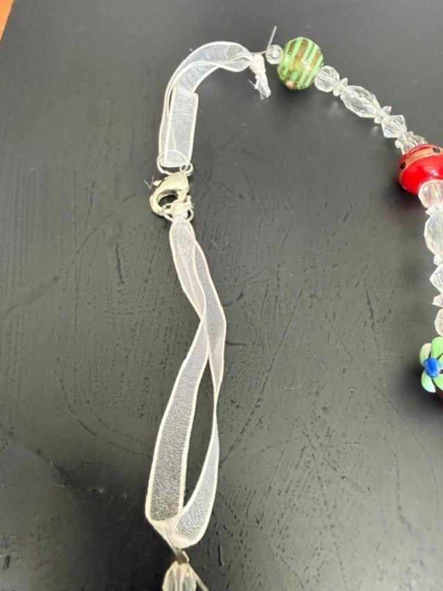 Extra-long multicolor lampwork-style glass bead necklace measuring approximately