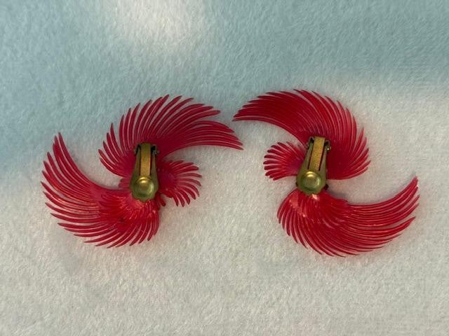 vintage soft-plastic feather or pinwheel clip-on earrings with clear rhinestone