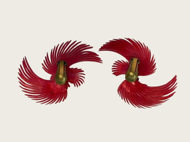 vintage soft-plastic feather or pinwheel clip-on earrings with clear rhinestone