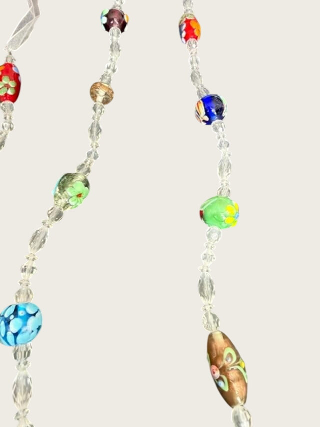 Extra-long multicolor lampwork-style glass bead necklace measuring approximately