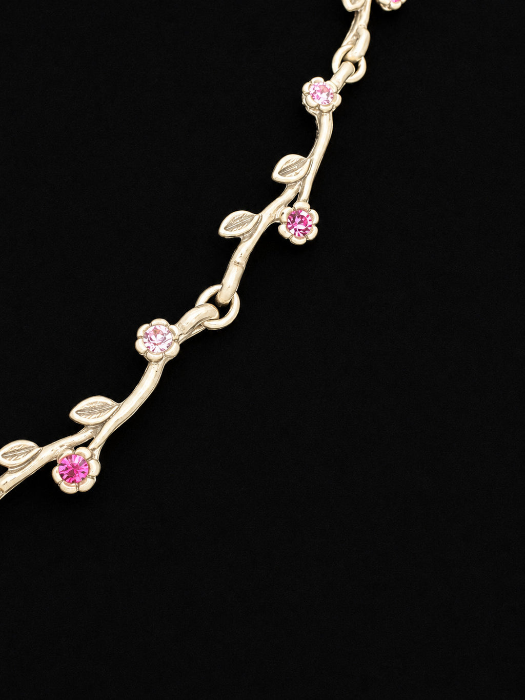 Openwork butterfly centerpiece with a pink rhinestone center