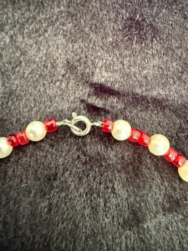 Vintage beaded necklace made with graduated cream faux pearl, red faceted beads