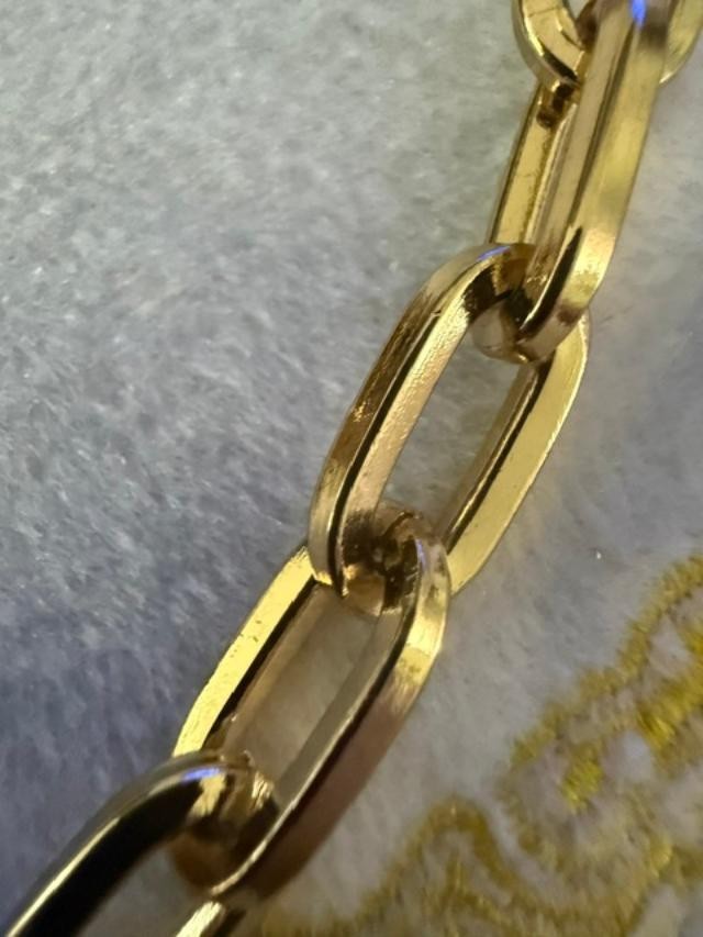 54" unmarked gold-tone heavy paperclip / rectangular link long chain necklace.
