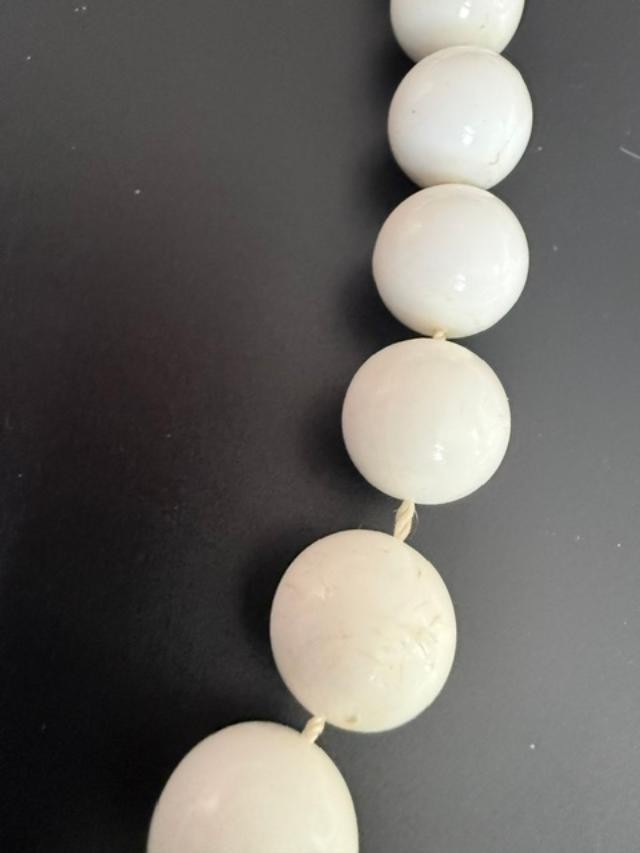 white bead necklace