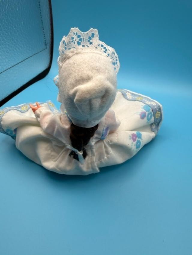 Vintage 6-inch hard-plastic doll with open-and-close sleep eyes, molded plastic