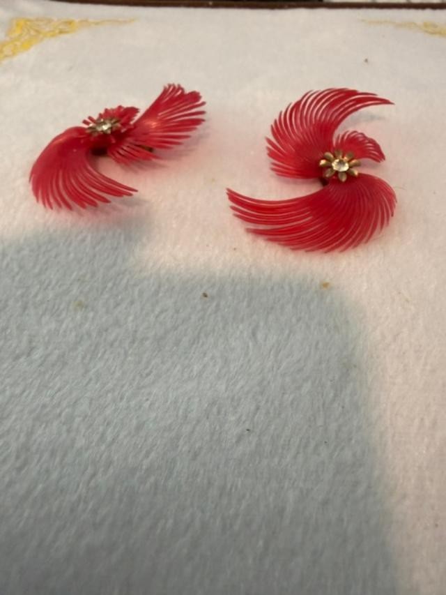 vintage soft-plastic feather or pinwheel clip-on earrings with clear rhinestone