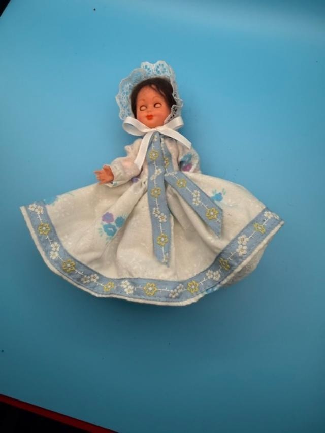 Vintage 6-inch hard-plastic doll with open-and-close sleep eyes, molded plastic