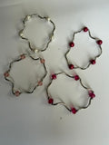 silver-tone beaded stretch bracelets featuring wavy/curved metal tube links with