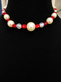 Vintage beaded necklace made with graduated cream faux pearl, red faceted beads