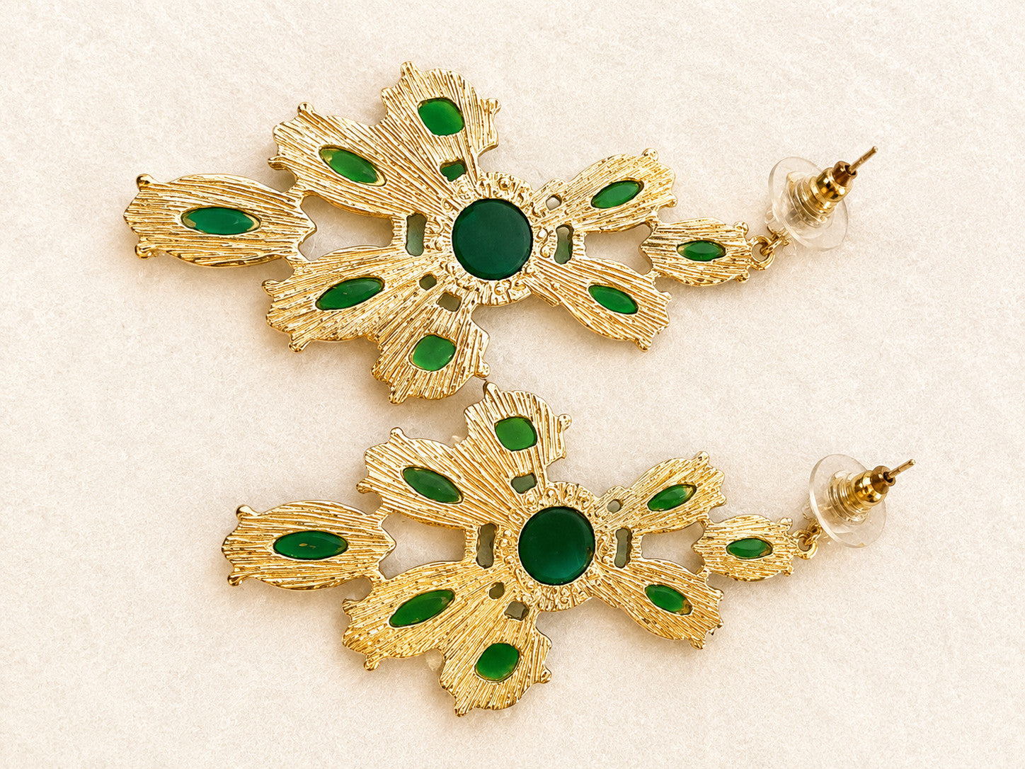 green chandelier earrings featuring multiple faceted oval and round stones in va