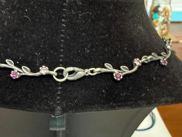 Openwork butterfly centerpiece with a pink rhinestone center