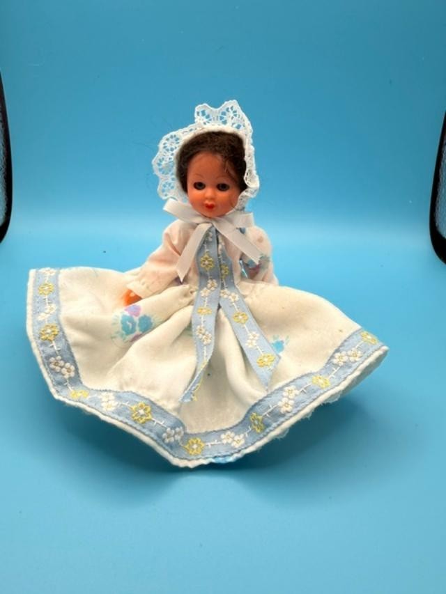 Vintage 6-inch hard-plastic doll with open-and-close sleep eyes, molded plastic