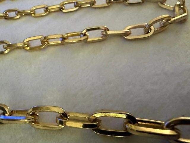 54" unmarked gold-tone heavy paperclip / rectangular link long chain necklace.