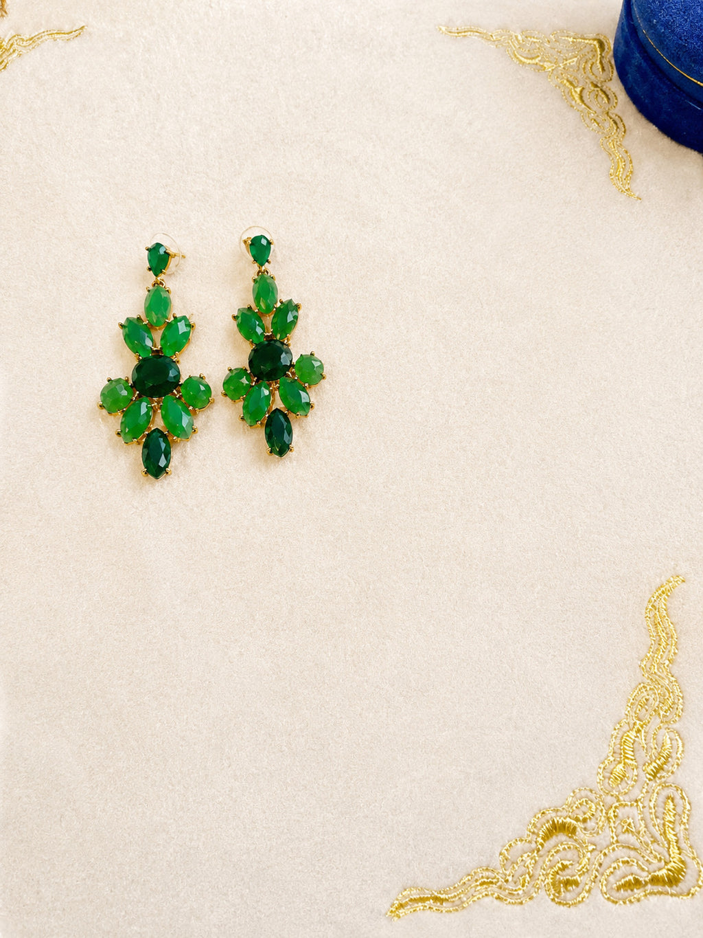 green chandelier earrings featuring multiple faceted oval and round stones in va