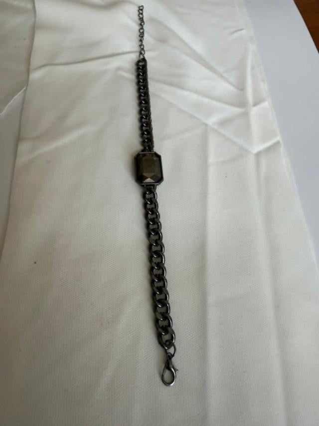 Gunmetal-tone curb-chain bracelet featuring a large rectangular faceted smoky