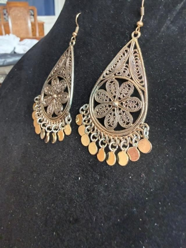 filigree Indian-style dangle earrings featuring an open teardrop frame, detailed