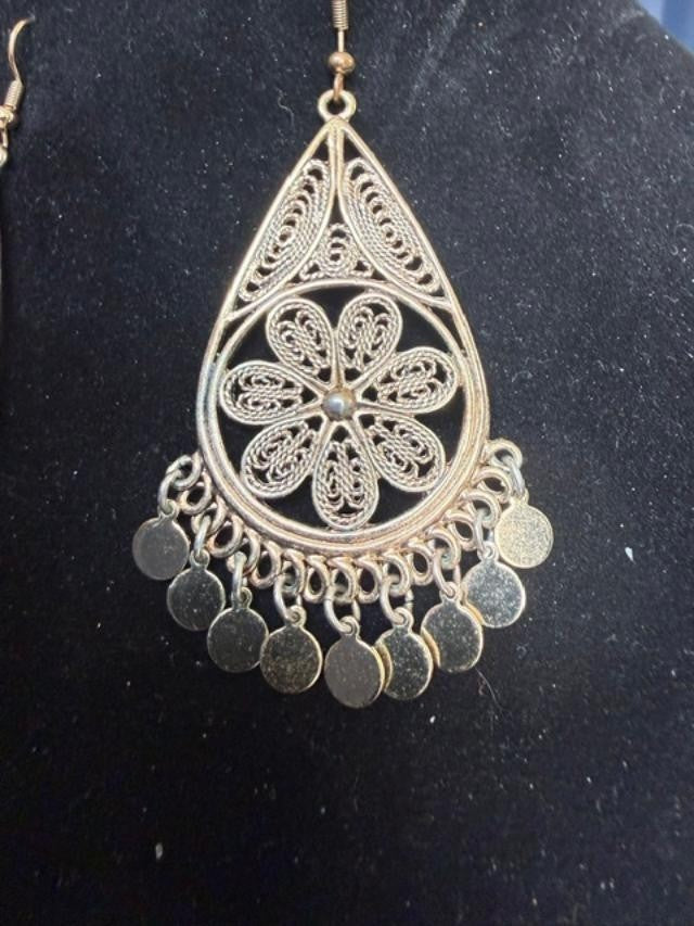 filigree Indian-style dangle earrings featuring an open teardrop frame, detailed