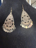 filigree Indian-style dangle earrings featuring an open teardrop frame, detailed