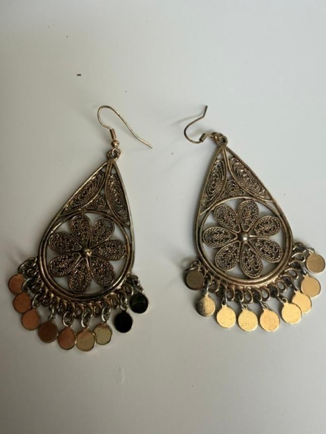 filigree Indian-style dangle earrings featuring an open teardrop frame, detailed