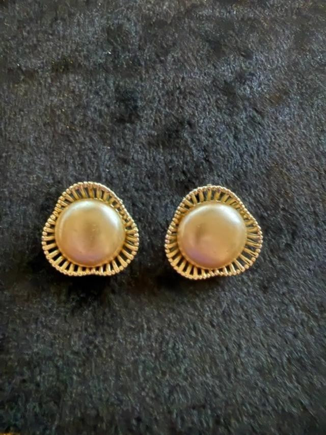 Vintage faux pearl earrings featuring soft champagne-colored pearl cabochons set