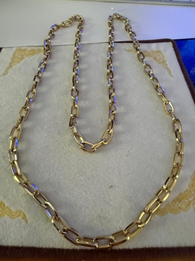 54" unmarked gold-tone heavy paperclip / rectangular link long chain necklace.