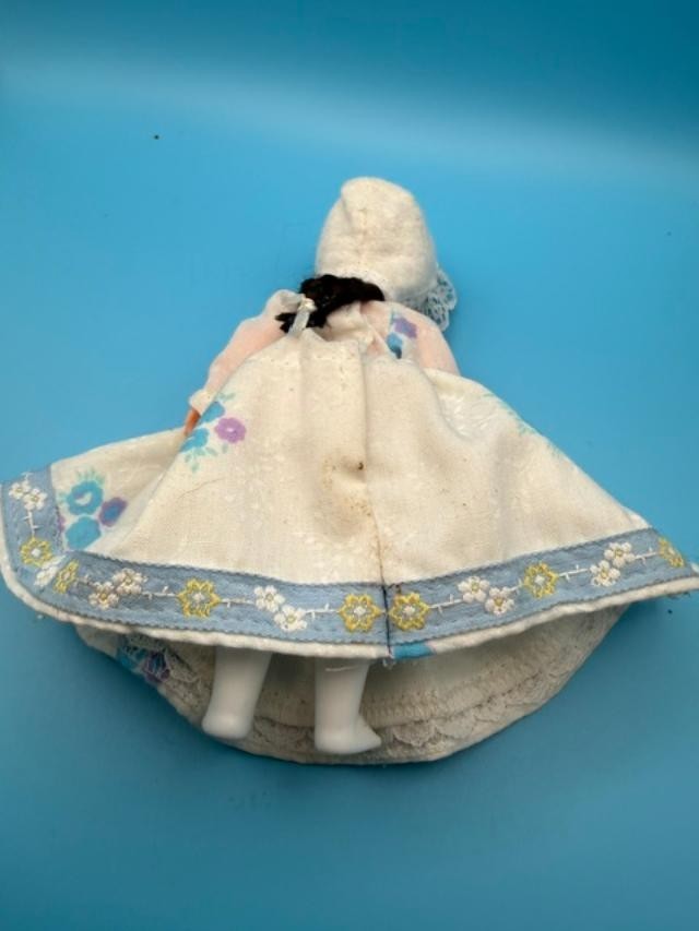 Vintage 6-inch hard-plastic doll with open-and-close sleep eyes, molded plastic
