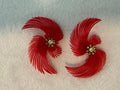 vintage soft-plastic feather or pinwheel clip-on earrings with clear rhinestone