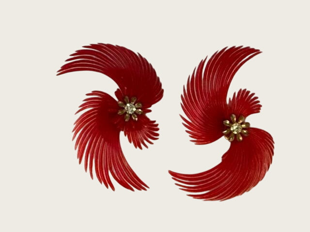 vintage soft-plastic feather or pinwheel clip-on earrings with clear rhinestone