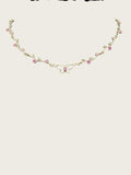 Openwork butterfly centerpiece with a pink rhinestone center