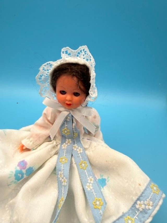 Vintage 6-inch hard-plastic doll with open-and-close sleep eyes, molded plastic