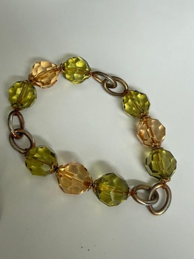 Pair of stretch-style beaded bracelets featuring faceted olive