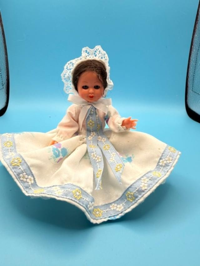 Vintage 6-inch hard-plastic doll with open-and-close sleep eyes, molded plastic