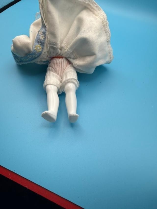 Vintage 6-inch hard-plastic doll with open-and-close sleep eyes, molded plastic
