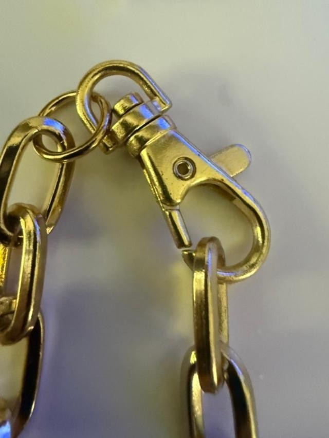 54" unmarked gold-tone heavy paperclip / rectangular link long chain necklace.